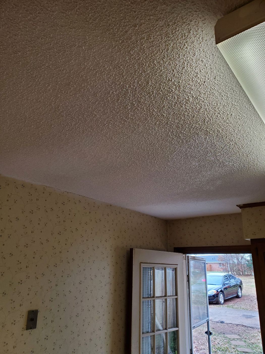 Popcorn ceiling repair in progress